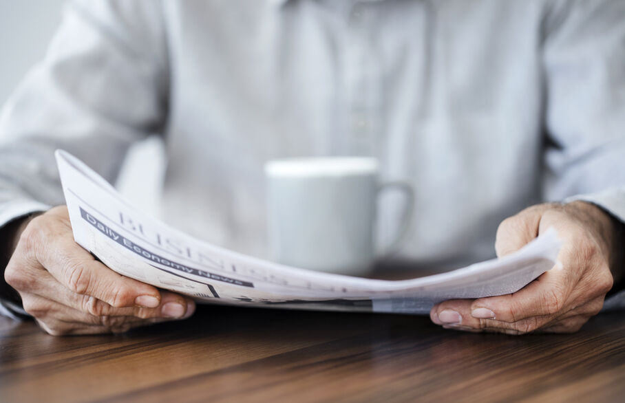 Someone reading a newspaper