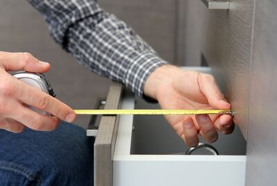Someone measuring a draw