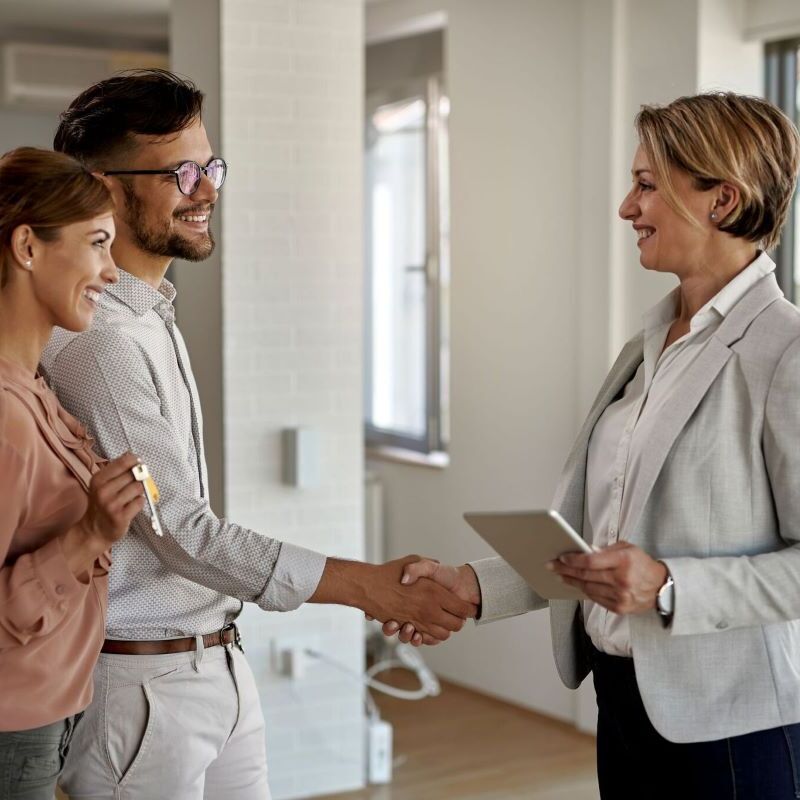 Valuation manager shaking hands with property owners